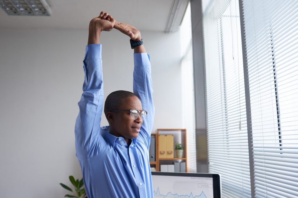 Man stretching at work